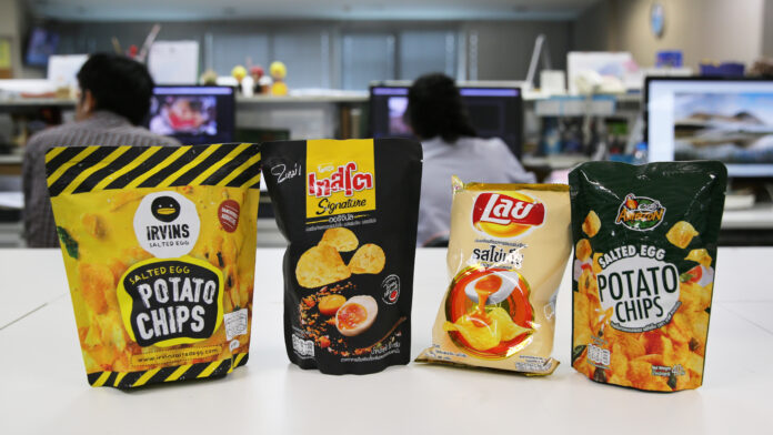 From the left: Irvins, Taste Signature, Lay’s, and Cafe Amazon salted egg potato chips