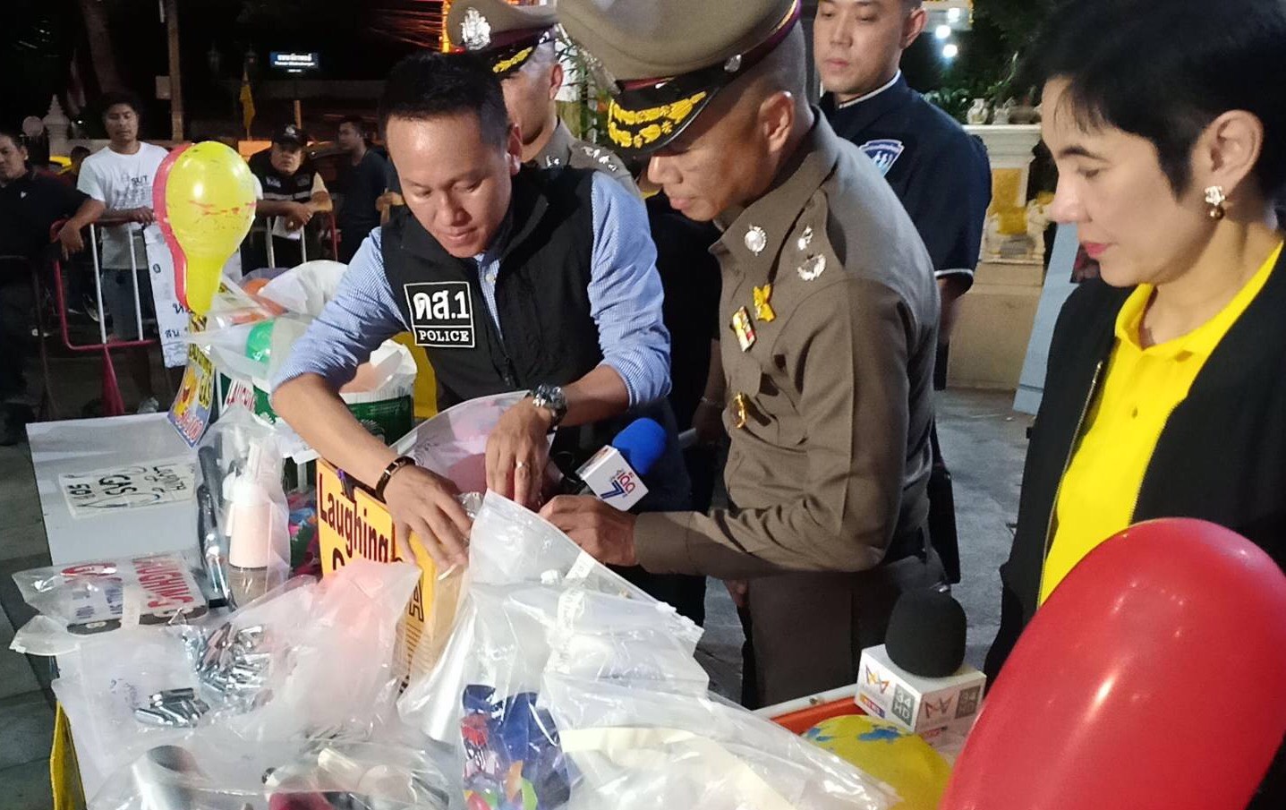 Officials examining the seized evidences on July 11.