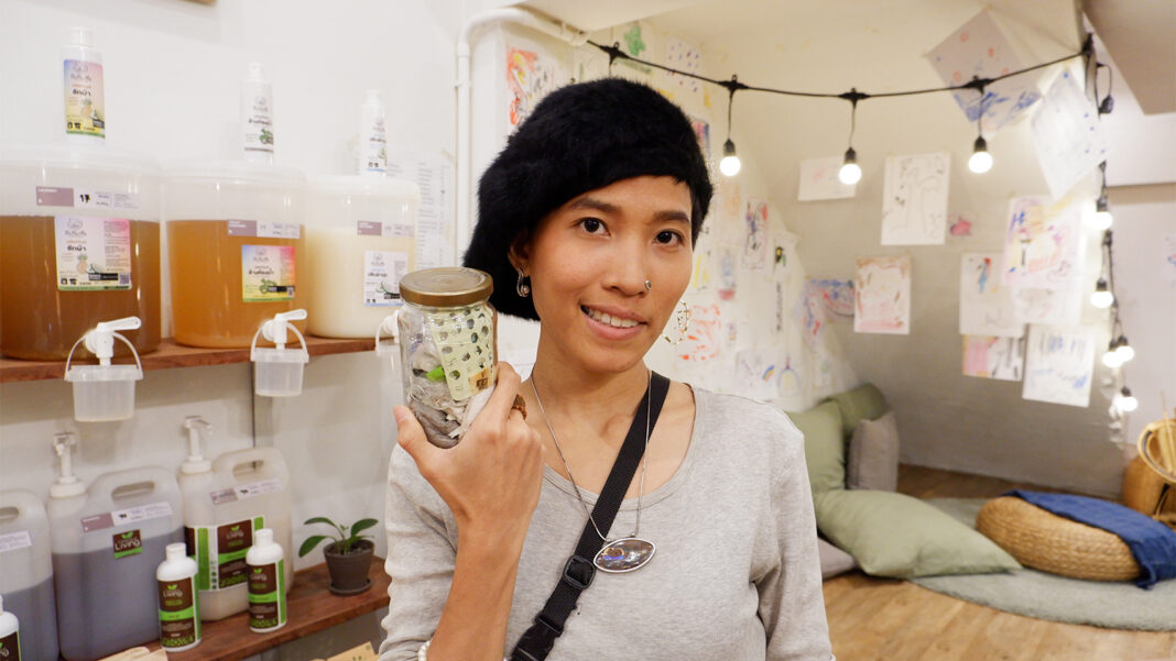 Environmental blogger Maneechanate Sammanee holding a glass jar on July 19.