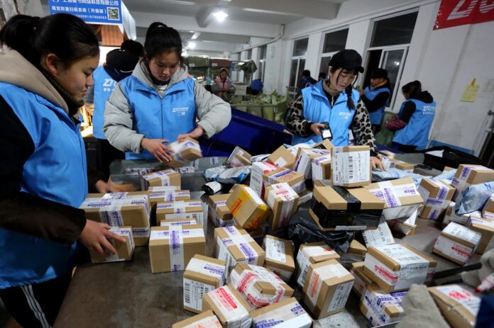 Workers sort parcels at an express delivery company on March 2, 2019, in Donghai County, east China's Jiangsu Province. (Xinhua/Zhang Kaihu)