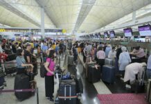 Travelers Welcome Restored Order at Hong Kong Airport