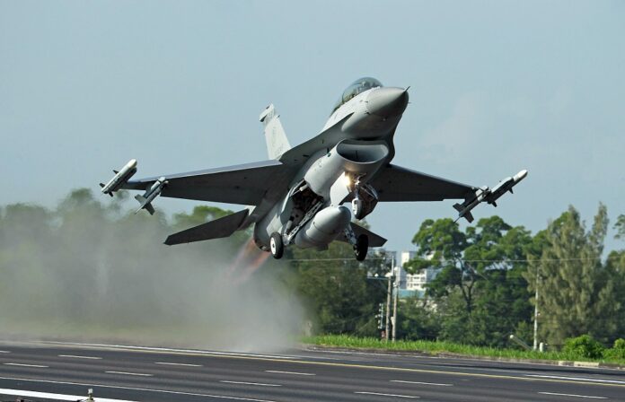 In this Sept. 16, 2014, file photo, a Taiwan Air Force F-16 fighter jet takes off from a closed section of highway during the annual Han Kuang military exercises in Chiayi, central Taiwan. (AP Photo/Wally Santana, File)