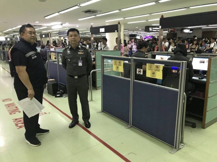 Immigration police at Don Mueang Airport on Aug. 12, 2018.
