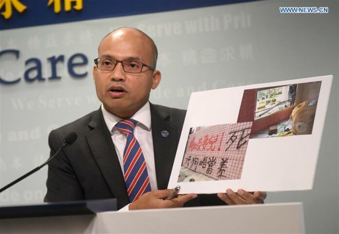 Swalikh Mohammed, Superintendent of Cyber Security and Technology Crime Bureau of the Hong Kong police, shows evidences of threats against Hong Kong police during a press conference in Hong Kong, south China, Aug. 22, 2019. (Xinhua/Lu Hanxin)