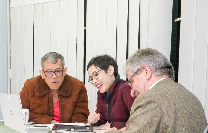 His Majesty the King, Chao Khun Phra Sineenat Wongvajirapakdi, and an unidentified man are seen in an official photo released by the Royal Household Bureau.