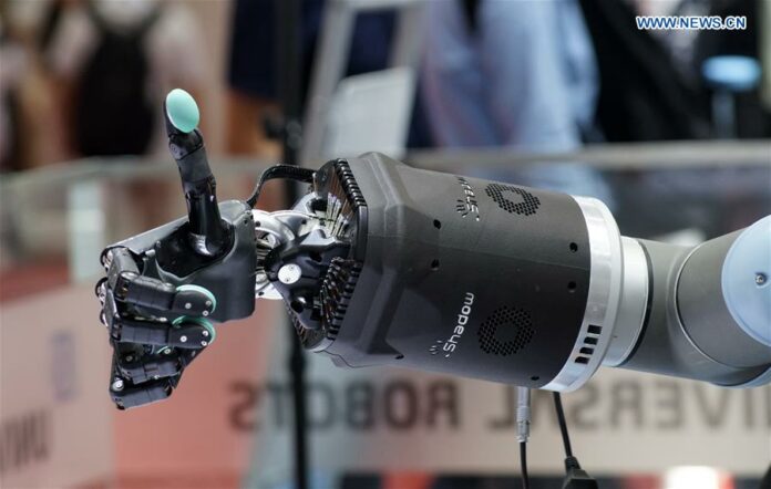 Photo taken on Aug. 21, 2019 shows an industrial robot exhibited at the World Robot Exhibition in Beijing, capital of China. The exhibition, part of the 2019 World Robot Conference that kicked off Tuesday, features various kinds of robots in different uses, including in industries, services and logistics. During the exhibition, the public have the opportunities to see exhibits of cutting-edge robot technologies and products from more than 180 renowned domestic and overseas companies and research institutions engaged in robot industries. (Xinhua/Li Xin)