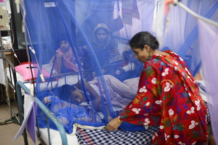 Bangladesh Dengue A woman stand by the bed of a child receiving treatment for dengue at Dhaka Shishu Hospital in Dhaka, Bangladesh, Wednesday, July 31, 2019. Photo: Mahmud Hossain Opu / AP