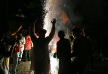 Redrawn Map May Set off More Change in Indian-Ruled Kashmir Supporters of India's ruling Bharatiya Janata Party (BJP) light firecrackers and celebrate the government revoking Kashmir's special status, in Lucknow, India, Tuesday, Aug. 6, 2019. Photo: Rajesh Kumar Singh / AP