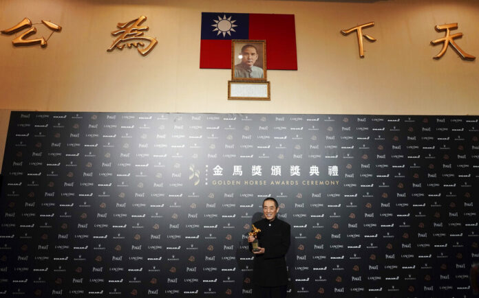 FILE - In this Nov. 17, 2018, file photo, Chinese director Zhang Yimou holds his award for Best Director at the 55th Golden Horse Awards in Taipei, Taiwan. China said Wednesday, Aug. 7, 2019, that it was banning Chinese movies and actors from participating in Taiwan's Golden Horse Awards, one of the Asian film industry's most prestigious honors, as Beijing continues efforts to bring economic and political pressure to bear on the island it claims as its own territory. Photo: Billy Dai / AP File