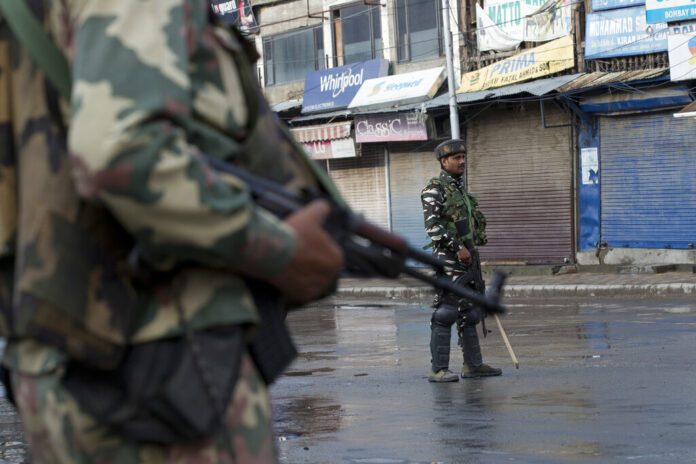 Indian Paramilitary soldiers stand guard on a deserted street during curfew in Srinagar, Indian controlled Kashmir, Thursday, Aug. 8, 2019. The lives of millions in India's only Muslim-majority region have been upended since the latest, and most serious, crackdown followed a decision by New Delhi to revoke the special status of Jammu and Kashmir and downgrade the Himalayan region from statehood to a territory. Kashmir is claimed in full by both India and Pakistan, and rebels have been fighting Indian rule in the portion it administers for decades. Photo: Dar Yasin / AP