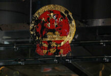 China Waiting out Hong Kong Protests, but Backlash May Come FILE - In this Sunday, July 21, 2019, file photo, the National Emblem of the People's Republic of China is covered in black paint thrown by protesters outside the Chinese Liaison Office in Hong Kong. China’s central government has dismissed Hong Kong pro-democracy protesters as clowns and criminals while bemoaning growing violence surrounding the monthslong demonstrations. Photo: Bobby Yip / AP File