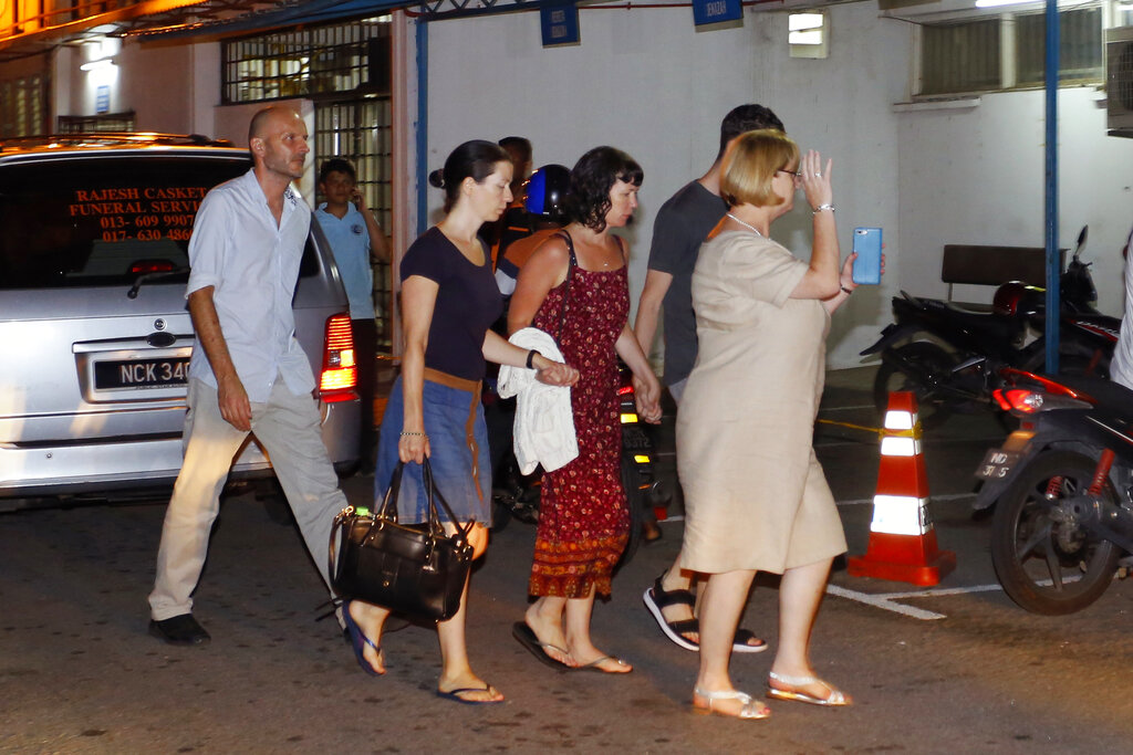 Family members of missing British girl Nora Anne Quoirin arrive at a hospital morgue in Seremban, Negeri Sembilan, Malaysia, Tuesday, Aug. 13, 2019. Photo: Lai Seng Sin / AP
