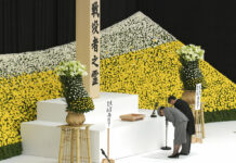 Japan’s New Emperor Remorseful in 1st War Anniversary Speech Japanese Emperor Naruhito, accompanied by Empress Masako bows after delivering a speech before the main altar decorated with huge bank of chrysanthemums during a memorial ceremony for the war dead at Nippon Budokan Martial Arts Hall in Tokyo Thursday, Aug. 15, 2019. Photo: Eugene Hoshiko / AP