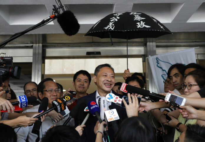 Occupy Central leader Benny Tai, center, talks to reporters outside the High court in Hong Kong Thursday, Aug.15, 2019. Tai, a top opposition leader imprisoned on public disorder charges was released on bail Thursday as Hong Kong's government attempts to quell a protest movement that has paralyzed parts of the territory, including its international airport, and led to hundreds of arrests. Photo: Vincent Yu / AP