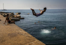 Scientists Confirm July Set New Global Heat Record FILE - In this file photo dated Thursday, July 25, 2019, a boy jumps into the water at the beach in Barcelona, Spain. The U.S. National Oceanic and Atmospheric Administration said Thursday Aug. 15, 2019, that July was the hottest month measured on Earth since records began in 1880. Photo: Emilio Morenatti / AP File