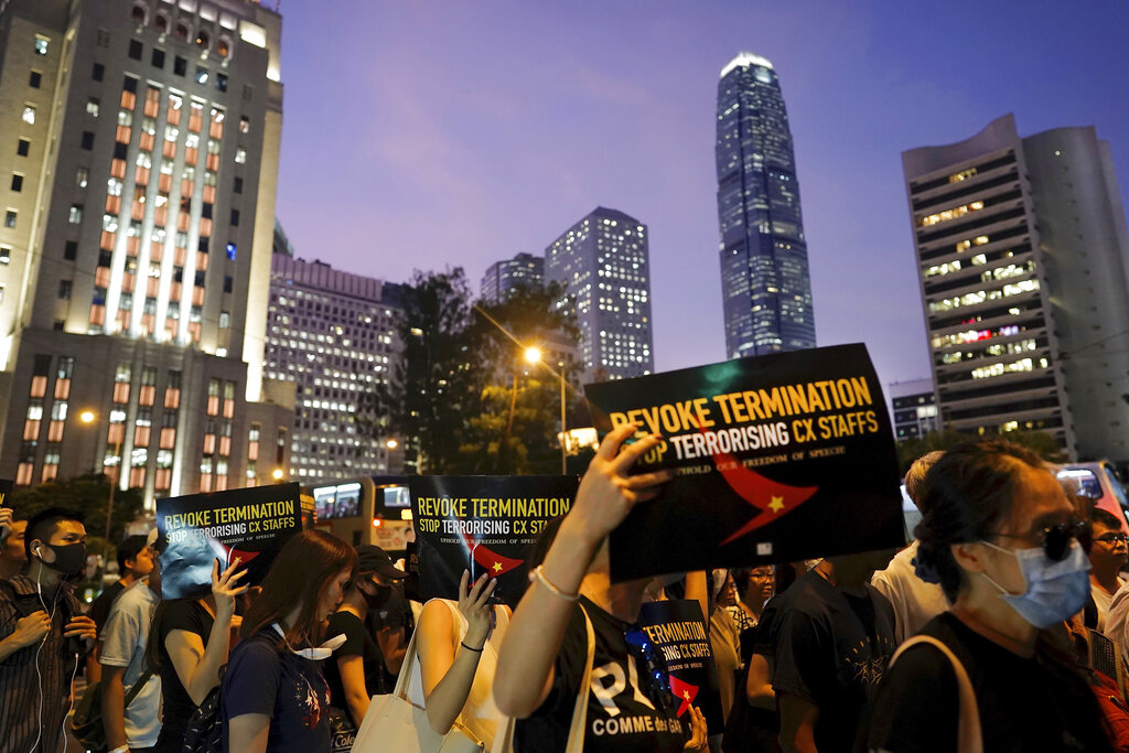 Demonstrators hold signs opposing the recent firings of Cathay Pacific employees as they gather for a demonstration at the Edinburgh Square in Hong Kong, Wednesday, Aug. 28, 2019. Photo: Vincent Yu / AP