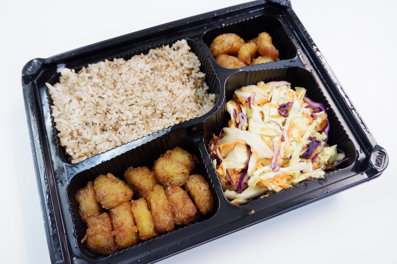 Coconut garlic rice, coleslaw, and bananas, part of the Super Combo Plate (320 baht).