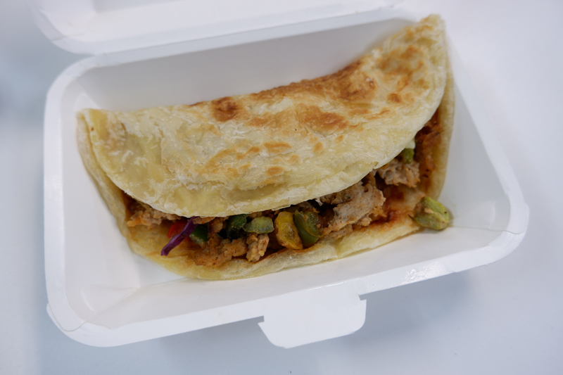 Jerk chicken roti.