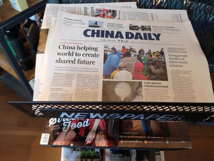 A pile of China Daily copies at a Starbucks in Bangkok on Aug. 20, 2019.