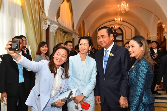 Prime Minister Prayuth Chan-ocha poses for selfies at Government House on Aug. 26, 2019.