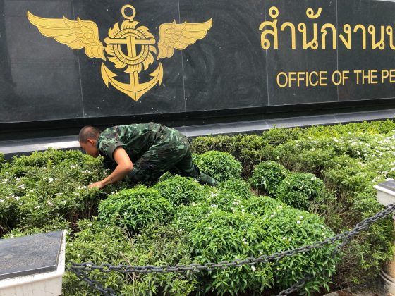A soldier inspects an "exploded spotlight" in front of the Office of the Permanent Secretary of Defense on Aug. 2, 2019.