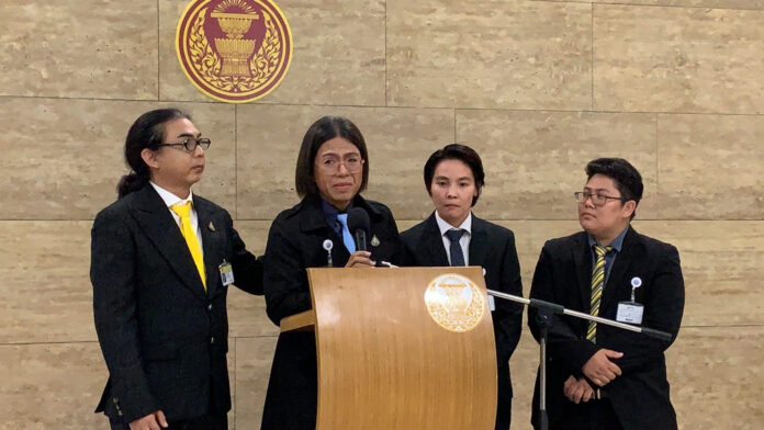 Tanwarin Sukkhapisit, second from the left, and Nathiphat Kunsetthasit, third from the left, and fellow Future Forward MPs during a press conference at the Parliament on Aug. 22.