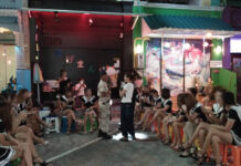 Thailand Still Hub of Global Sex Trafficking Rings: UN Suspected sex workers waiting outside while the police raided a bar in Si Racha, Chonburi on Aug. 15.