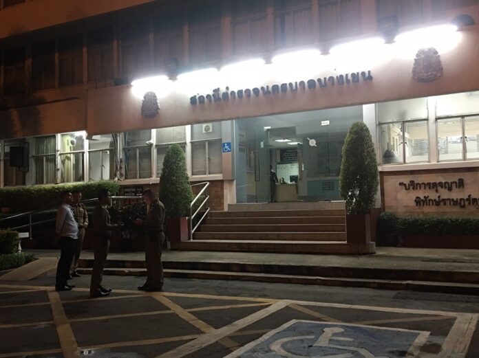 Police search for evidence in front of Bang Khen Police Station on Aug. 22, 2019.
