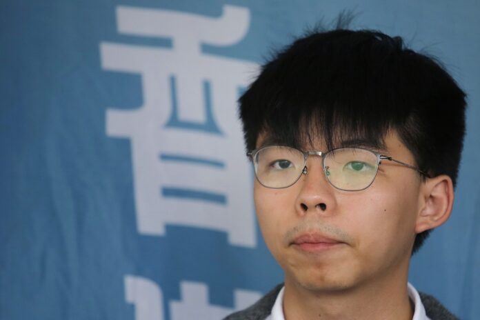 In this May 16, 2019, file photo, Pro-democracy activist Joshua Wong speaks to media at a court in Hong Kong. (AP Photo/Kin Cheung, File)