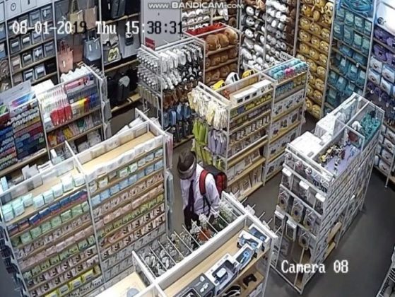 In this CCTV footage, a suspect with a hat on is seen wandering around Miniso on Thursday afternoon.