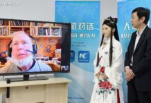 Chinese, Russian Officials Vow Closer Media Cooperation Chen Xiaoping (R), director of a robot research and development team, and Jia Jia, an interactive robot that looks like a real Chinese young woman in traditional outfit, talk through internet with Kevin Kelly on screen, founding executive editor of Wired magazine, in Hefei, capital of east China's Anhui Province, April 24, 2017. Jia Jia was invited as a special reporter of the Xinhua News Agency to conduct the man-machine dialogue with Kelly on Monday. Jia Jia was unveiled in 2016 by Chen's robot research and development team at the University of Science and Technology of China in Hefei. It took the team three years to research and develop this new-generation interactive robot, which can speak, show micro-expressions, move its lips, and move its body. Photo: Guo Chen / Xinhua