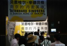 Danish Hero During Nanjing Massacre Commemorated in China, Denmark Visitors tour the photo exhibition "Bernhard Sindberg: A Danish Hero of Nanjing" in Nanjing, capital of east China's Jiangsu Province, Aug. 31, 2019. Photo: Xinhua