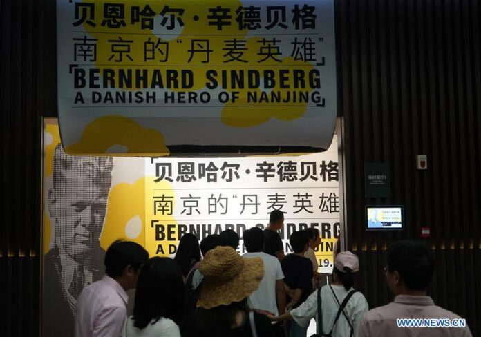 Visitors tour the photo exhibition 