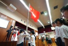 New Semester Starts in Hong Kong, Violence Deplored Young flag guards perform their duty at a flag-raising ceremony at the Wong Cho Bau School in China's HKSAR on Sept. 2, 2019. Photo: Qin Qing / Xinhua