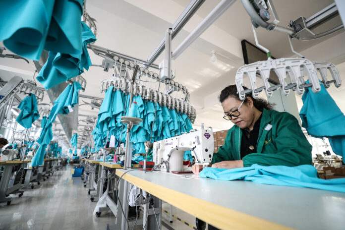 A worker makes bikini at a workshop of a sportswear company in Huludao City, northeast China's Liaoning Province, March 6, 2019. Photo: Pan Yulong / Xinhua