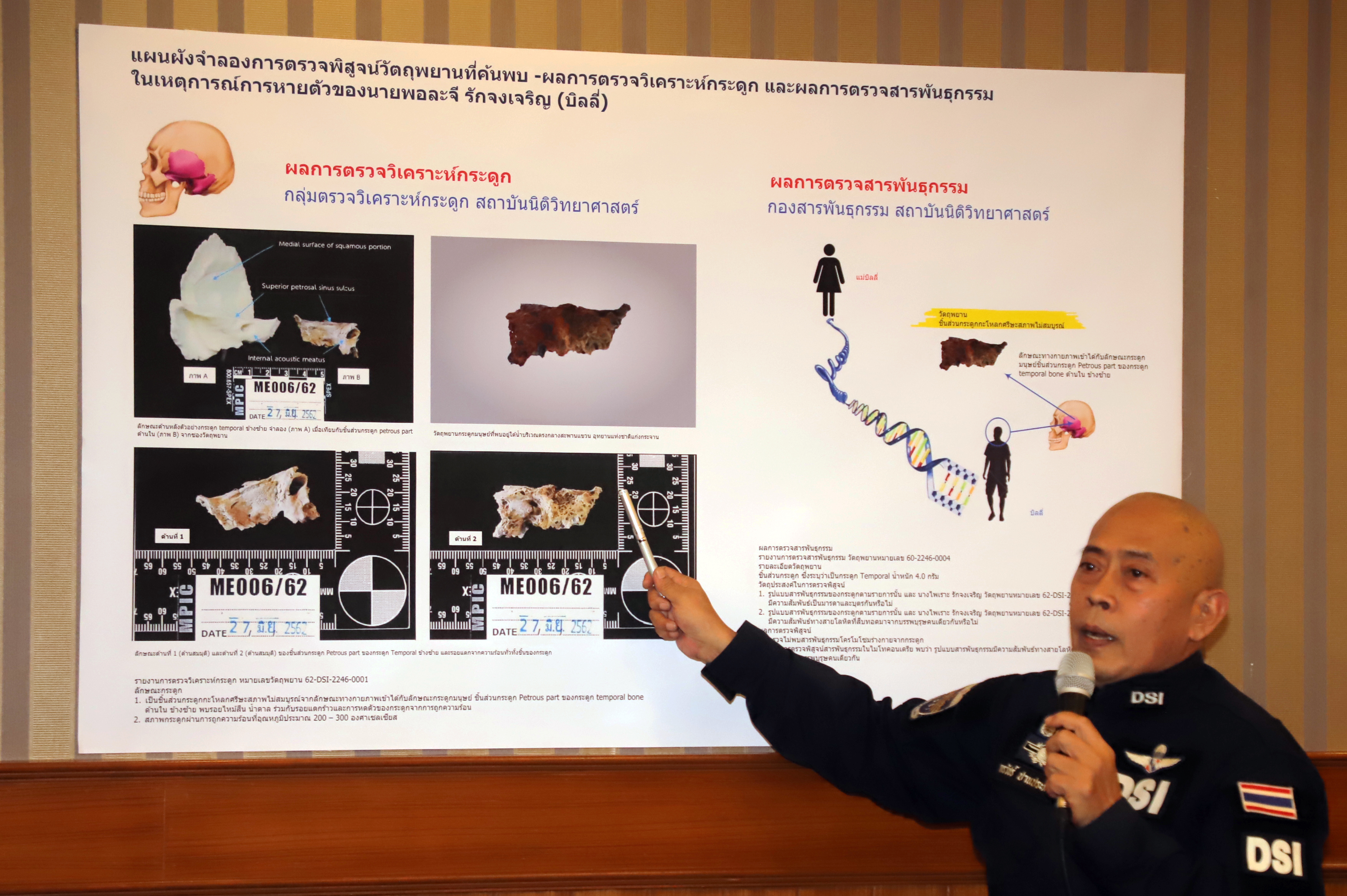 A DSI official pointing at a poster which shows the analysis of bone fragments found at the scene during a press conference on Sept. 3.