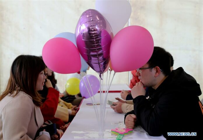 A file photo of people taking part in a matchmaking event in Shanghai on Nov. 17, 2018. (Xinhua/Liu Ying)