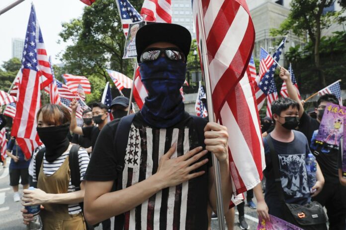 Protesters shout slogans during a protest in Hong Kong, Sunday, Sept. 8, 2019. (AP Photo/Kin Cheung)