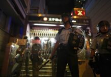 Hong Kong Police Storm Subway With Batons as Protests Rage Police stand guard outside while police arrest protesters at Prince Edward MTR Station, Hong Kong, Saturday, Aug. 31, 2019. Hundreds of people are rallying in an athletic park in central Hong Kong as a 13th-straight weekend of pro-democracy protests gets underway. Photo: Vincent Yu / AP
