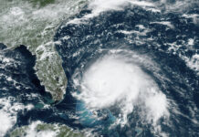 Record-Setting Hurricane Dorian Keeps Pounding North Bahamas This GOES-16 satellite image taken Sunday, Sept. 1, 2019, at 17:00 UTC and provided by National Oceanic and Atmospheric Administration (NOAA), shows Hurricane Dorian, right, churning over the Atlantic Ocean. Hurricane Dorian struck the northern Bahamas on Sunday as a catastrophic Category 5 storm, its 185 mph winds ripping off roofs and tearing down power lines as hundreds hunkered in schools, churches and other shelters. Photo: NOAA via AP