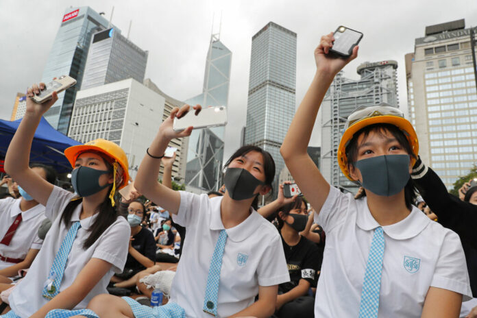 Students wear protective gear during a protest in Hong Kong, Monday, Sept. 2, 2019. Hong Kong has been the scene of tense anti-government protests for nearly three months. The demonstrations began in response to a proposed extradition law and have expanded to include other grievances and demands for democracy in the semiautonomous Chinese territory. Photo: Kin Cheung / AP