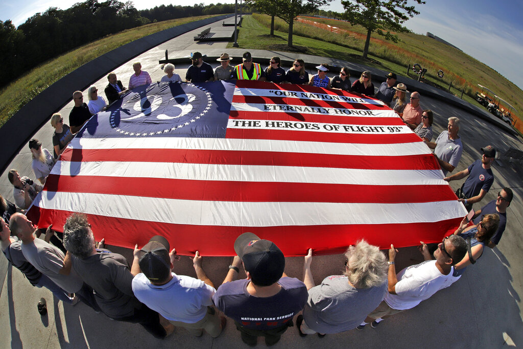 Visitors to the Flight 93 National Memorial in Shanksville, Pa., participate in a sunset memorial service on Tuesday, Sept. 10, 2019, as the nation prepares to mark the 18th anniversary of the Sept. 11, 2001 attacks. Photo: Gene J. Puskar / AP