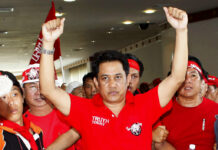 High Court Affirms Guilt of 2009 Red Shirt Pattaya Rioters In this April 11, 2009, file photo, anti-government leader Arisman Pongruangrong is cheered as he and others march through the 14th ASEAN Convention Center in Pattaya, Thailand. Thailand's Supreme Court has affirmed the prison sentences of 12 members of the "Red Shirt" political movement on charges related to rioting that disrupted an important regional conference in 2009. Photo: David Longstreath / AP