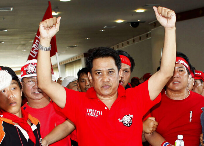In this April 11, 2009, file photo, anti-government leader Arisman Pongruangrong is cheered as he and others march through the 14th ASEAN Convention Center in Pattaya, Thailand. Thailand's Supreme Court has affirmed the prison sentences of 12 members of the In this April 11, 2009, file photo, anti-government leader Arisman Pongruangrong is cheered as he and others march through the 14th ASEAN Convention Center in Pattaya, Thailand. Thailand's Supreme Court has affirmed the prison sentences of 12 members of the
