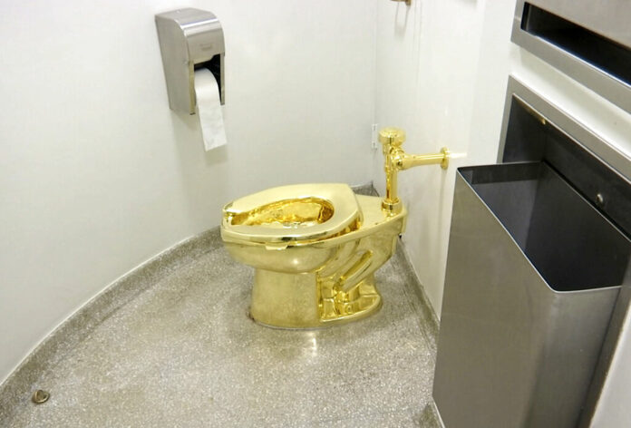 FILE - This Sept. 16, 2016 file image made from a video shows the 18-karat toilet, titled 