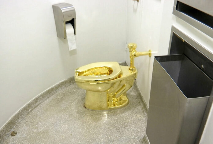 FILE - This Sept. 16, 2016 file image made from a video shows the 18-karat toilet, titled FILE - This Sept. 16, 2016 file image made from a video shows the 18-karat toilet, titled