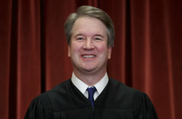 In this Nov. 30, 2018, file photo Associate Justice Brett Kavanaugh sits with fellow Supreme Court justices for a group portrait at the Supreme Court Building in Washington. Photo: Scott Applewhite / AP