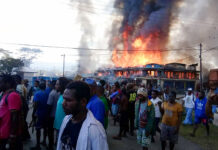 20 Killed, 70 Hurt in Protests in Indonesia’s Papua Province People gather as shops burn in the background during a protest in Wamena in Papua province, Indonesia, Monday, Sept 23, 2019. Hundreds of protesters in Indonesia's restive Papua province set fire to homes and other buildings Monday in a protest sparked by rumors that a teacher had insulted students, and a soldier was killed in another protest in the region, police said. Photo: AP
