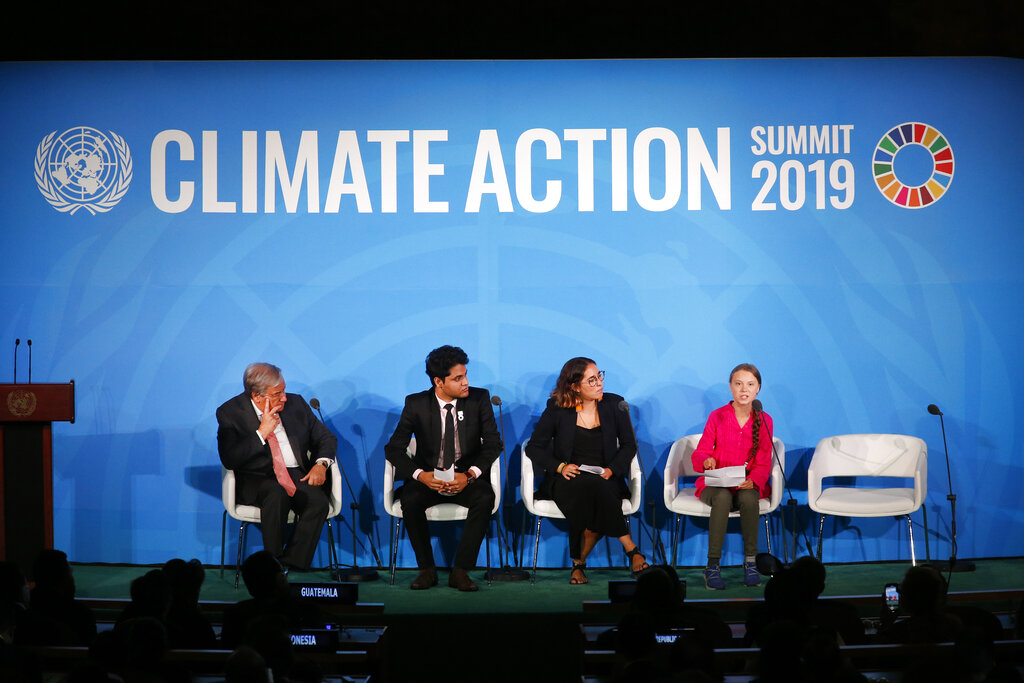 United Nations Secretary-General Antonio Guterres, far left, and young environmental activists look on as Greta Thunberg, of Sweden, far right, addresses the Climate Action Summit in the United Nations General Assembly, at U.N. headquarters, Monday, Sept. 23, 2019. Photo: Jason DeCrow / AP