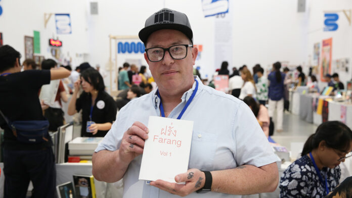 Nathan Larkin holding his latest publication “Farang Vol. 1” at Bangkok Art Book Fair on Sept. 5. Nathan Larkin holding his latest publication “Farang Vol. 1” at Bangkok Art Book Fair on Sept. 5.